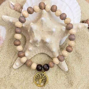 Beaded bracelet - wood beads with gold tone tree of life charm